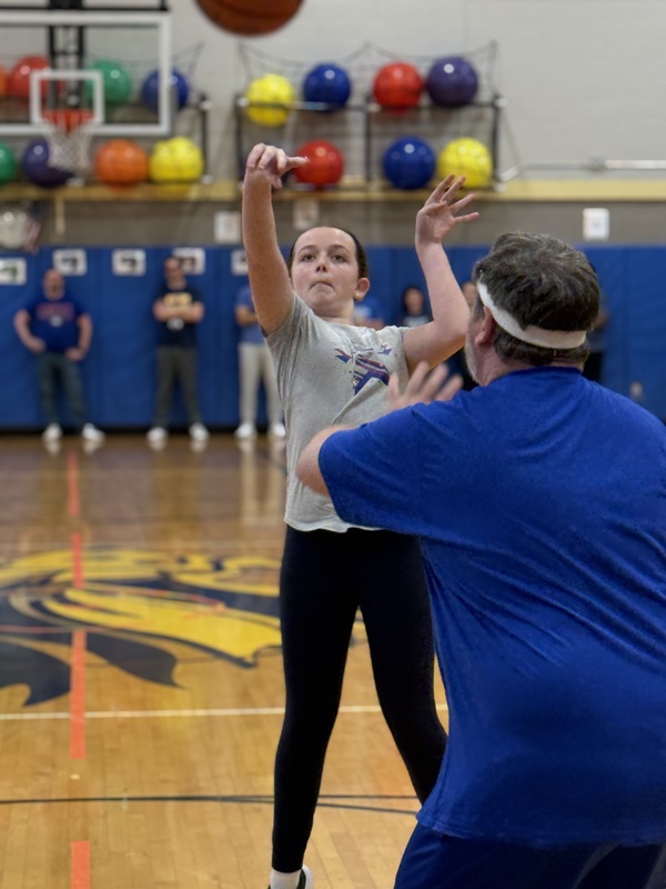 girl throwing basketball