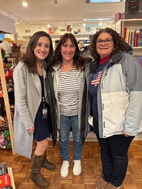 three teachers smiling