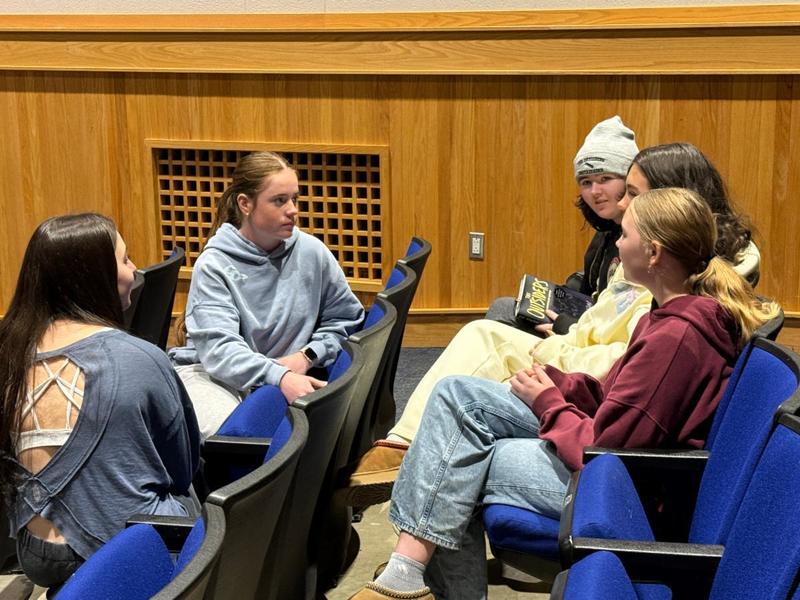 8th graders and high schoolers talking about Lionslink mentorship program