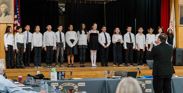 Students dressed up on stage.