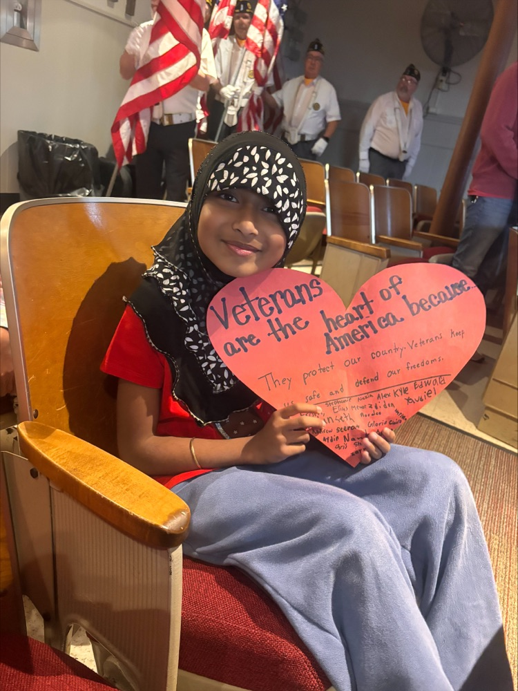 Child holding a heart