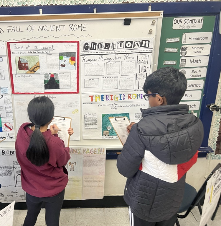 kids looking at projects on Ancient Rome