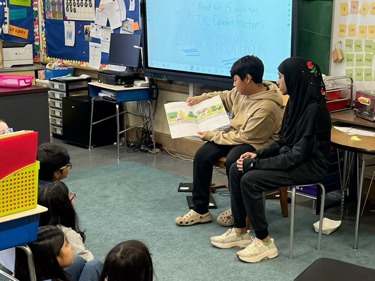 students reading two a class