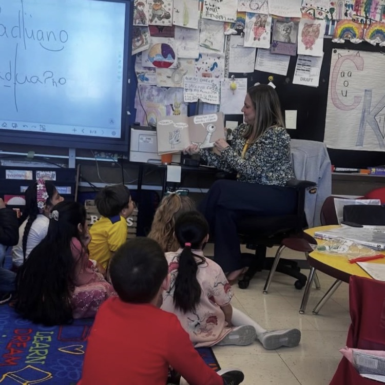 a teacher reading to kids