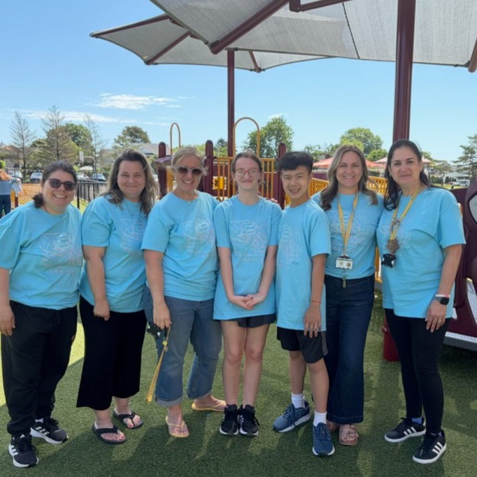 people wearing the same blue shirt