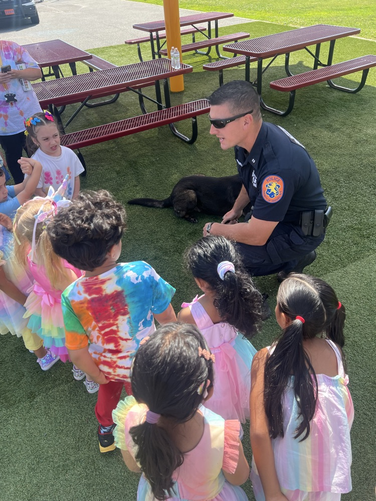 kids speaking to a police officer
