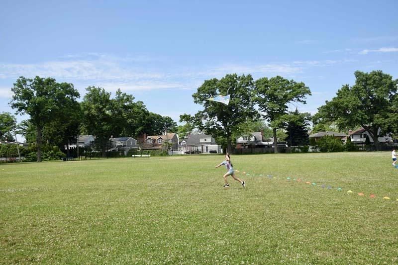 Students playing volleyball outside.