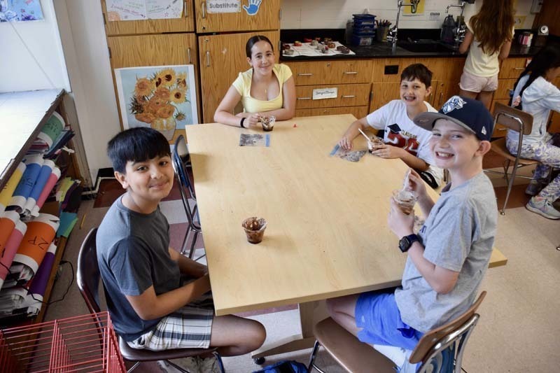 Students sitting together at table.