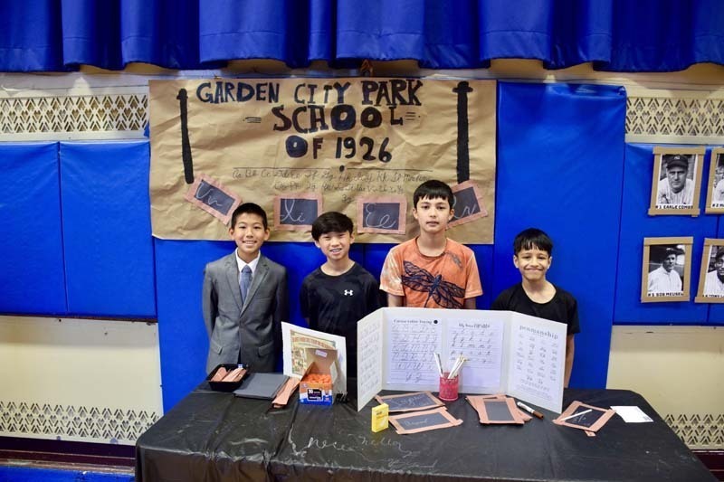 Students smiling together in gymnasium.