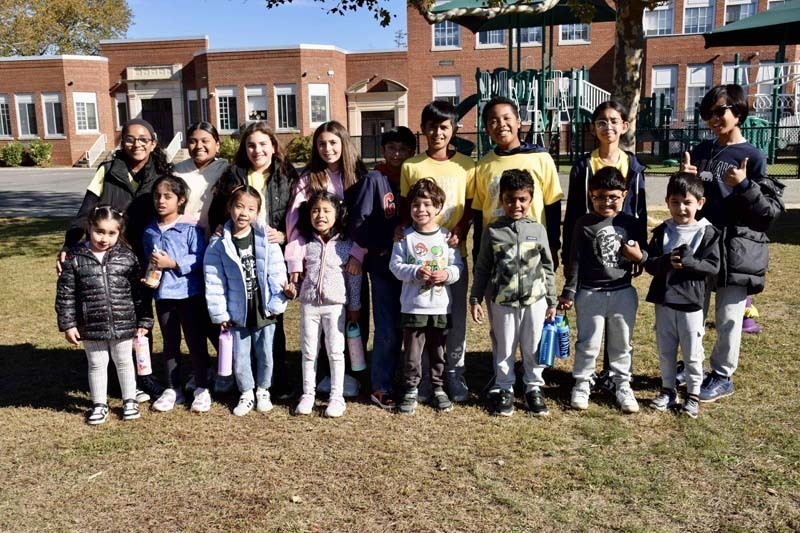 Students standing together outside.