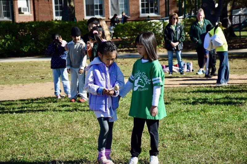 Students standing together outside.