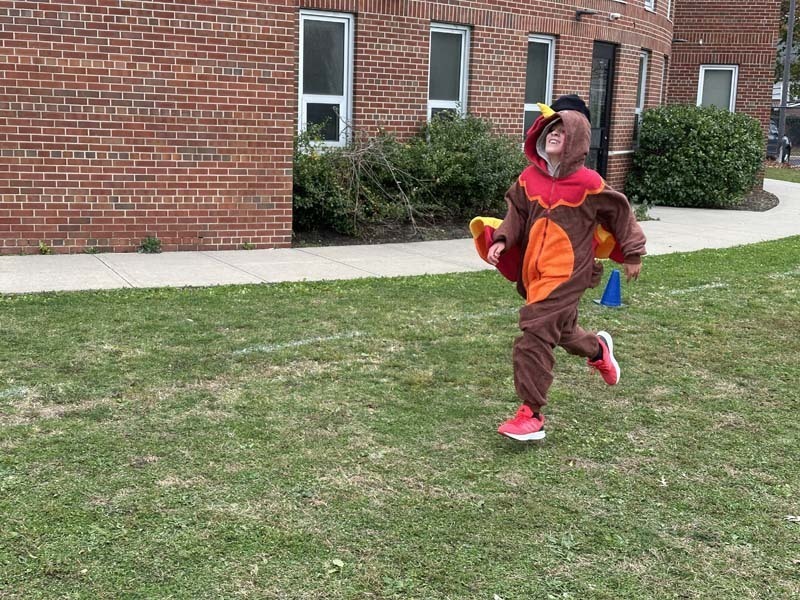 Students running outside.