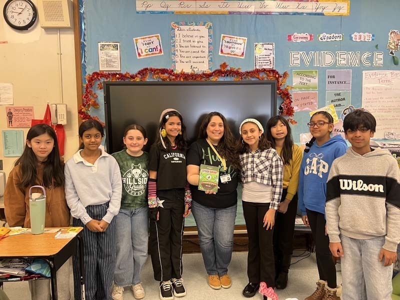 Writing contest winners with teacher.