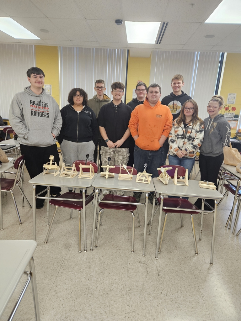 MMR Students pose with their catapult after launching marshmallows.