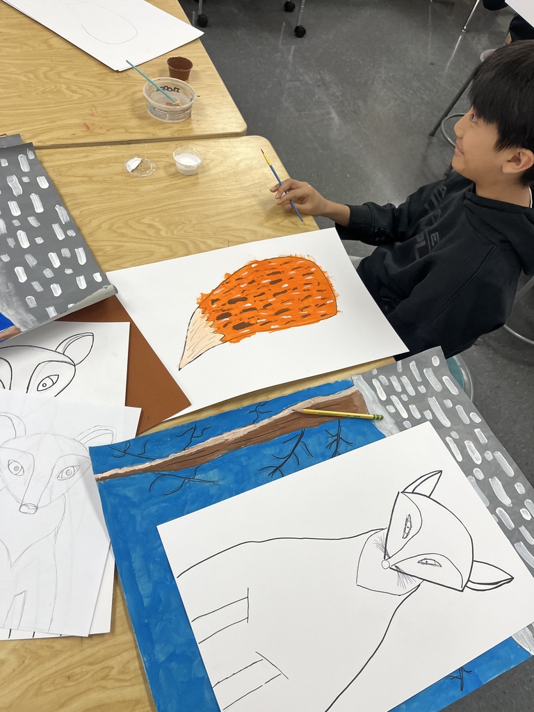 Student painting a fox tail.