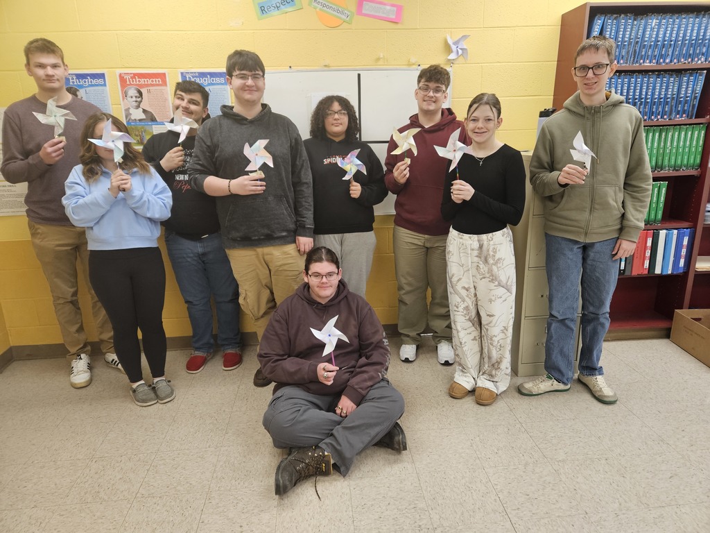 MMR Students display their pinwheels which they made as part of their logo design.