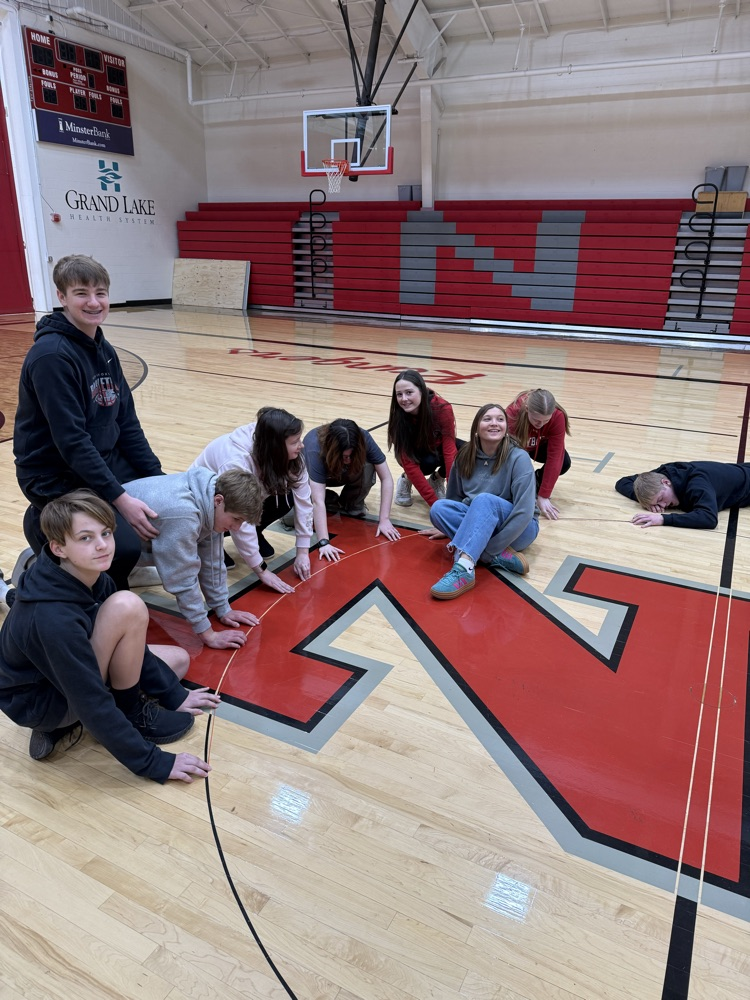 Geometry Class is using string to measure the ratio of circumference to diameter of a circle. Happy pi day tomorrow .