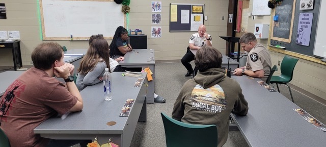 The sheriff and SRO talking to a Criminal Justice class.