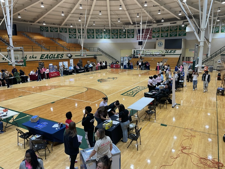 overall view of students in a gym at a career fair