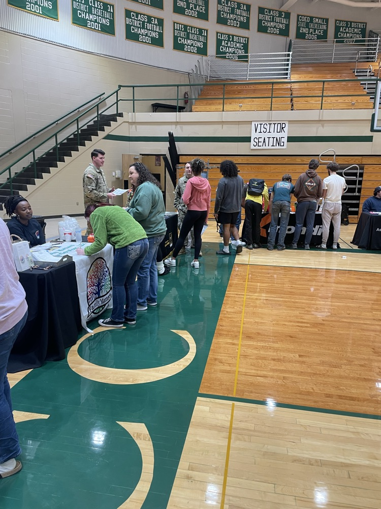 students visiting booths at a high school career fair