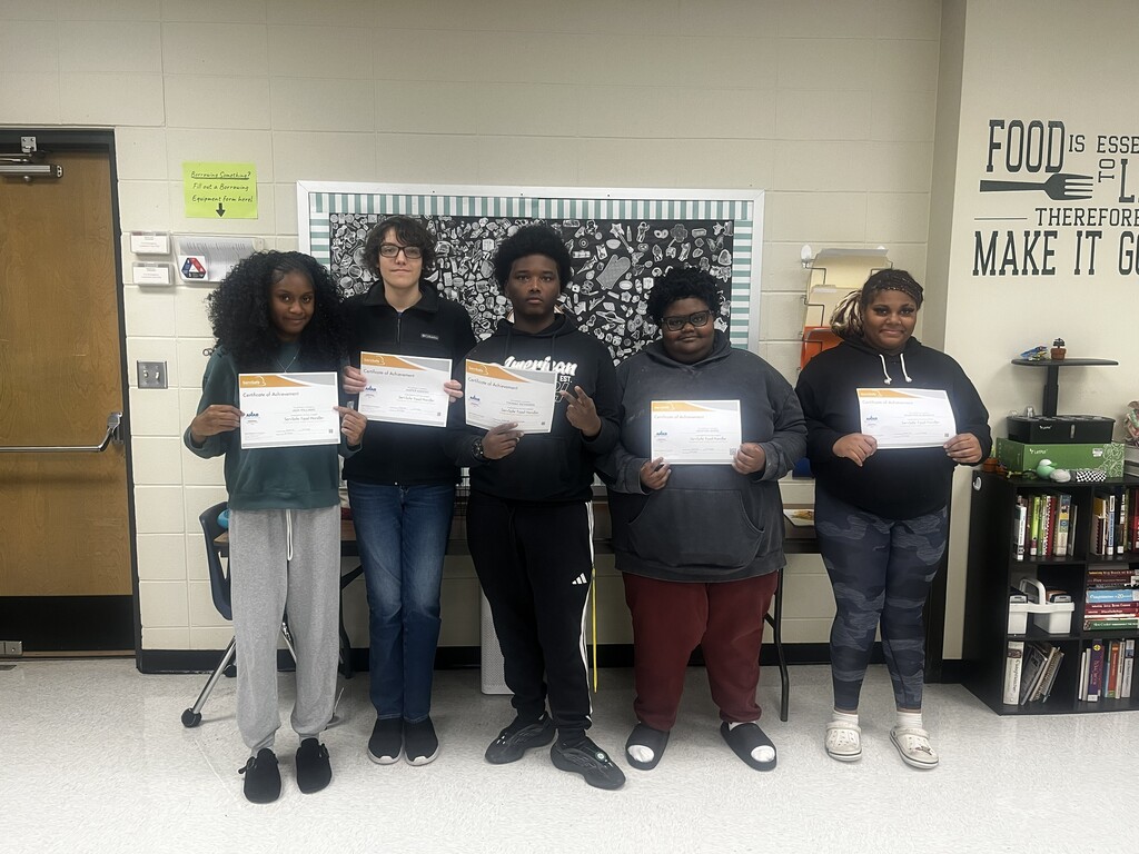 Afternoon students holding their certifications 