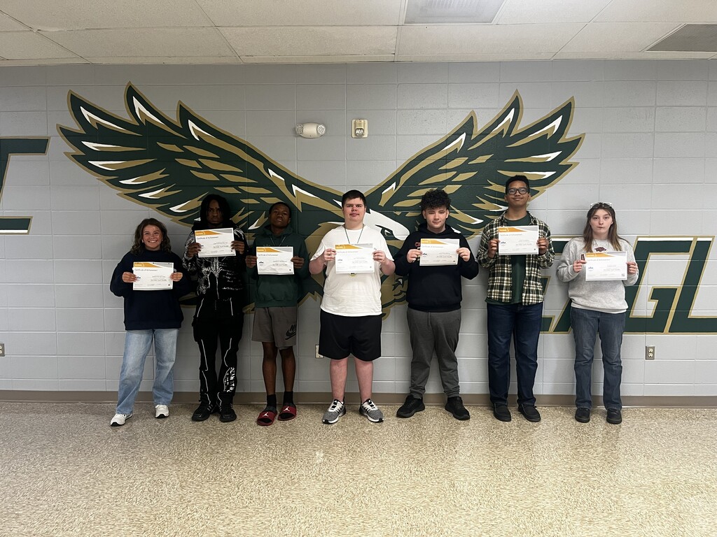 Morning students holding their certifications 