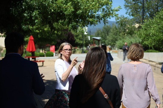 Dr. Herbold guiding a campus tour for NMHED officials