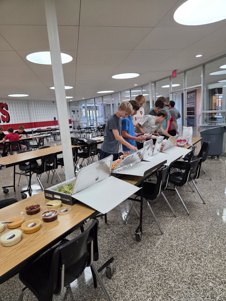 More students enjoying the donated food