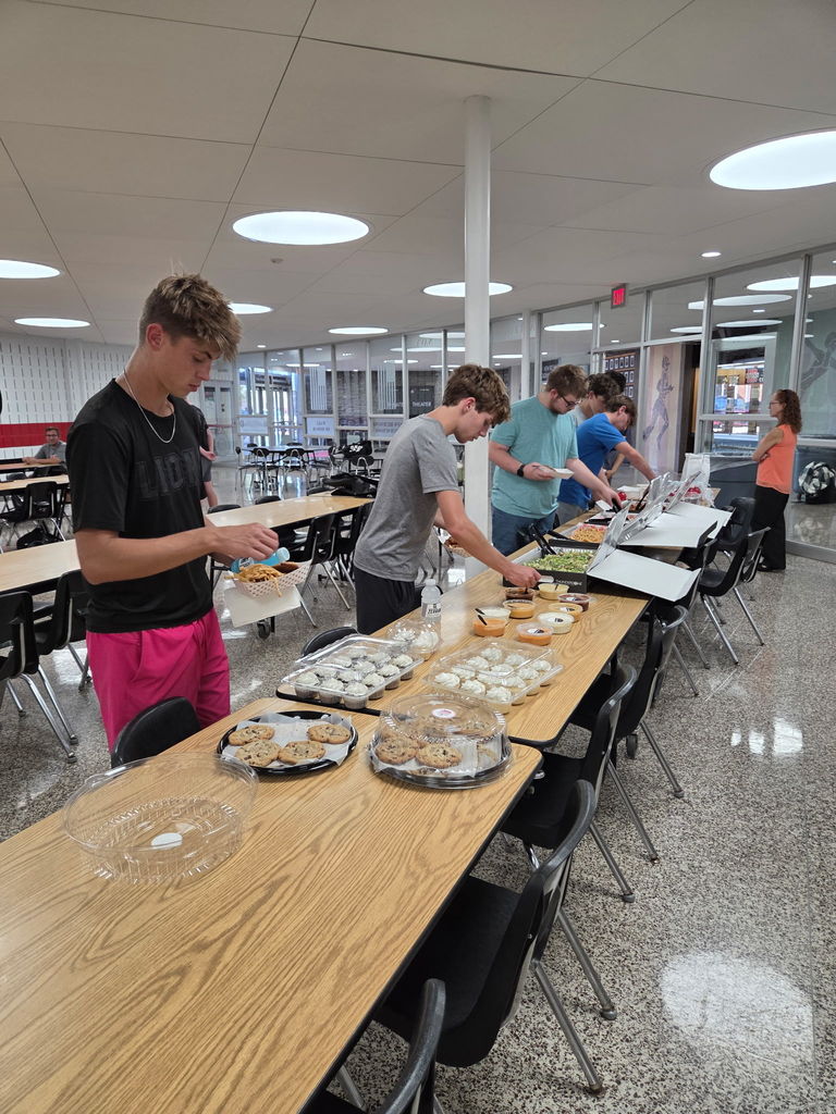 Students line up at the table for food