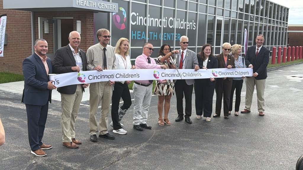 Representatives prepare to cut the ribbon on the CCHMC Health Center at NRMS!