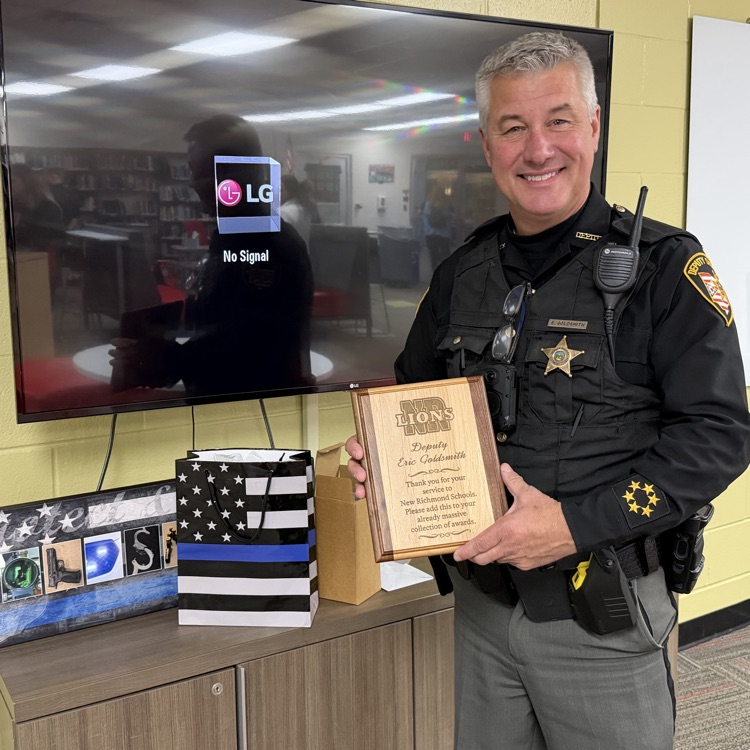 Deputy Goldsmith poses with his gifts 