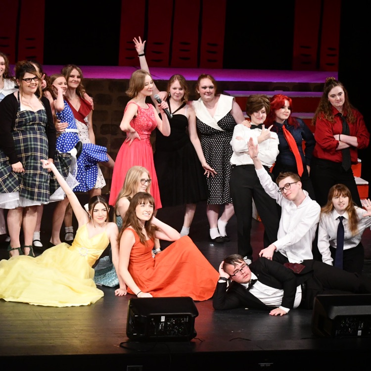 Part of the Ensemble cast wraps up a song