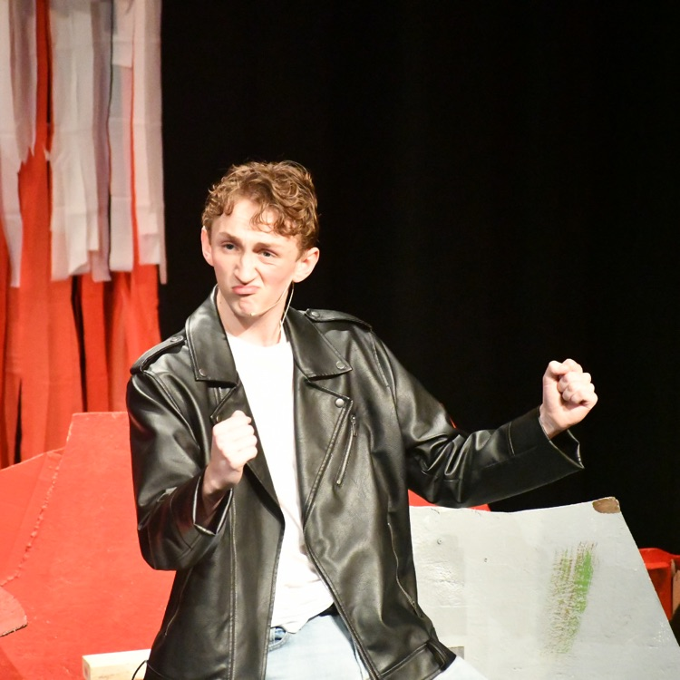 a still from the Grease musical