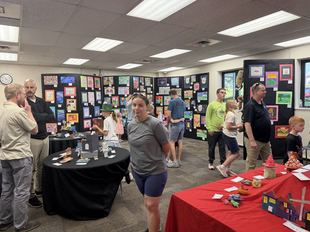 The crowd from opening night at the district art show