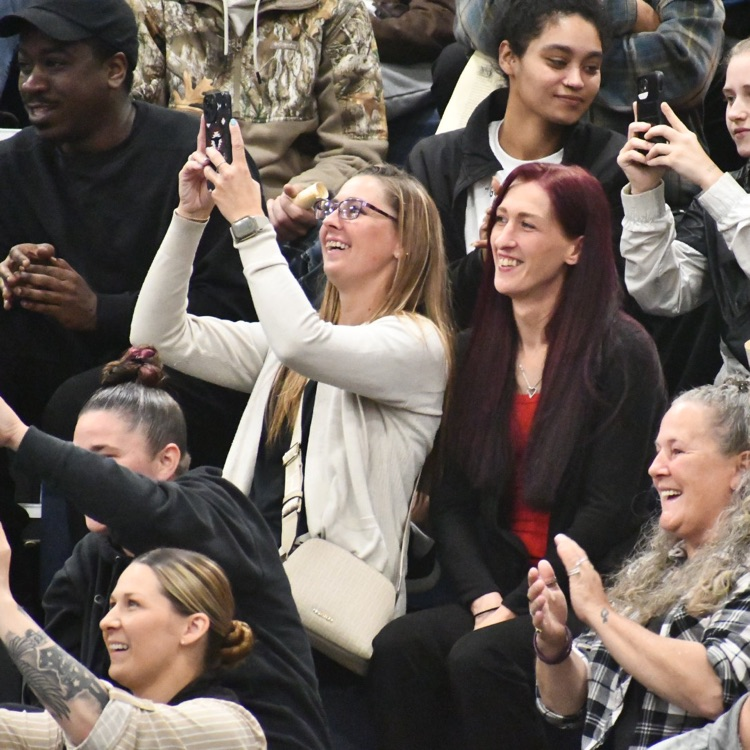 crowd taking photos and videos