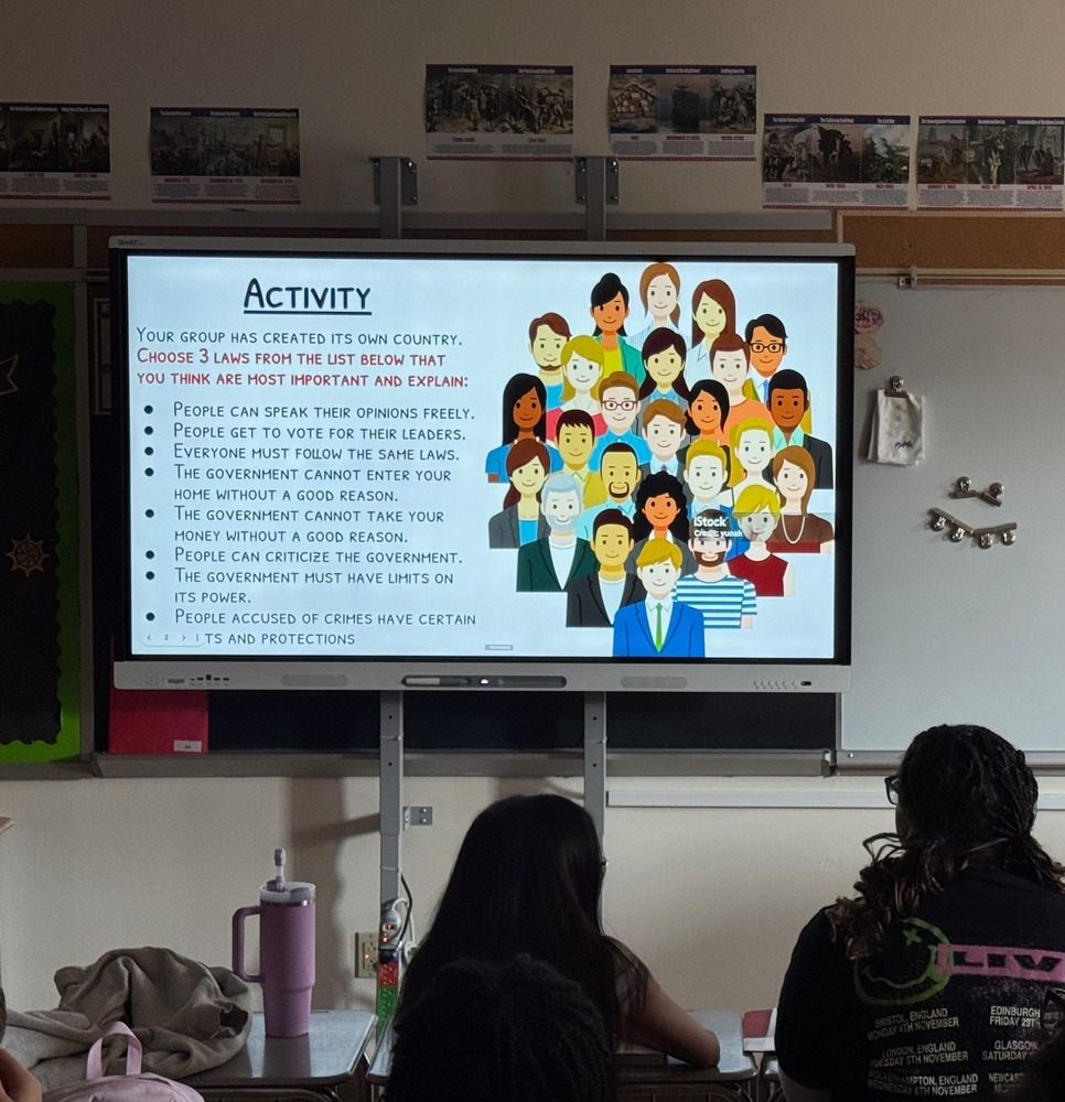 Students in a classroom looking at a Constitution Day activity