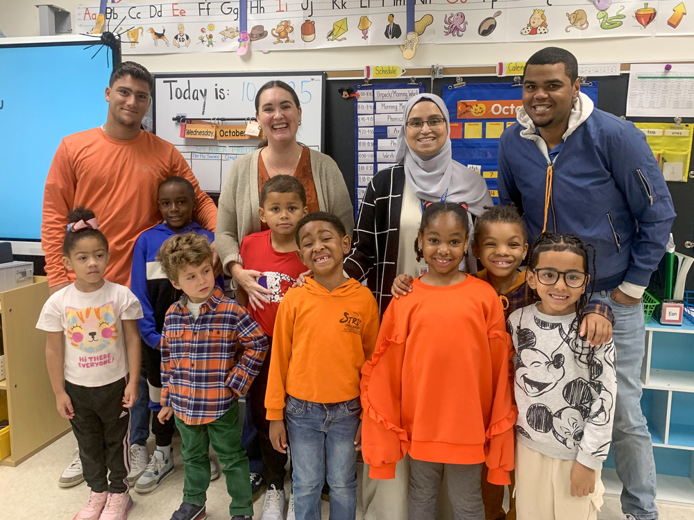 A photo of staff and students dressed in orange for Unity Day