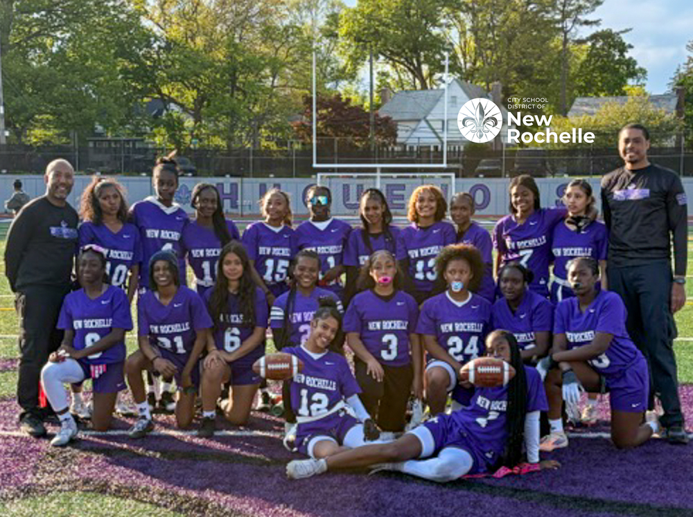 The jv girls flag  football team and coaches