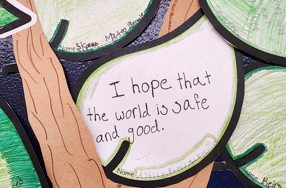 Child's art that reads I hope that the world is safe and good