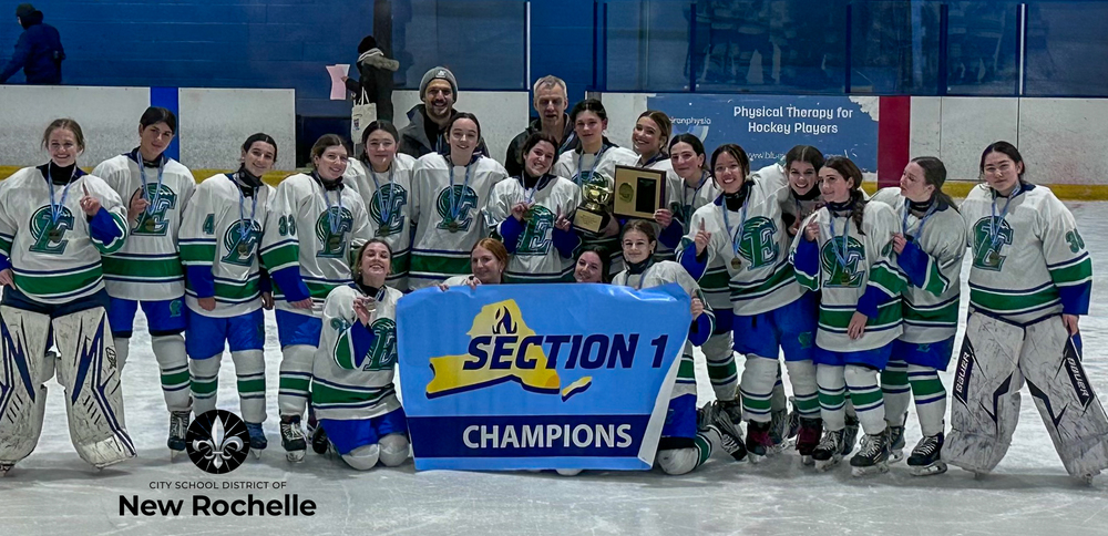 The green wave hockey team holding their section 1 banner and trophies