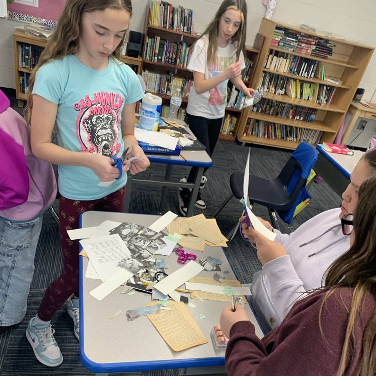 Fifth grade making bookmarks out of old books for reading month!