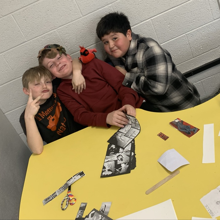 Fifth grade making bookmarks out of old books for reading month!