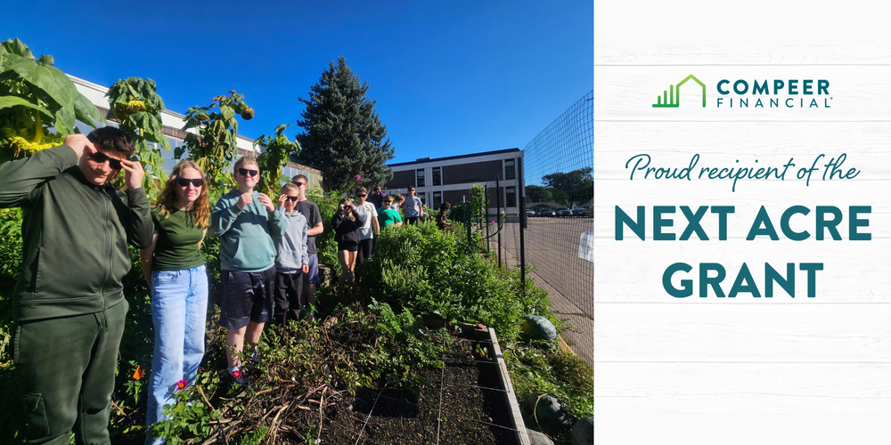 Photo of people in the Middle School garden and the text: Proud recipient of the Next Acre Grant.