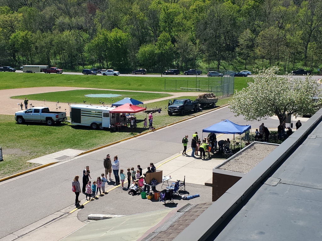 A rooftop view of some of the presentations being put on by the FFA students and the younger students watching and interacting.