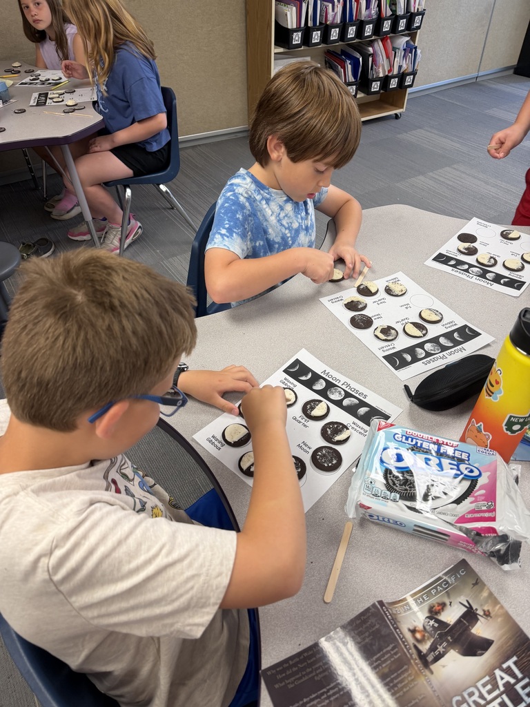 2 students working on their moon phases.