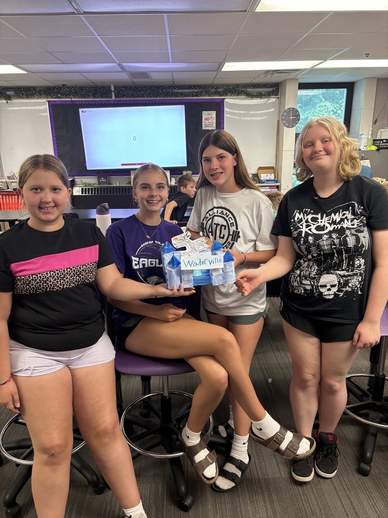 4 students and their blue castle, titled Waterville.