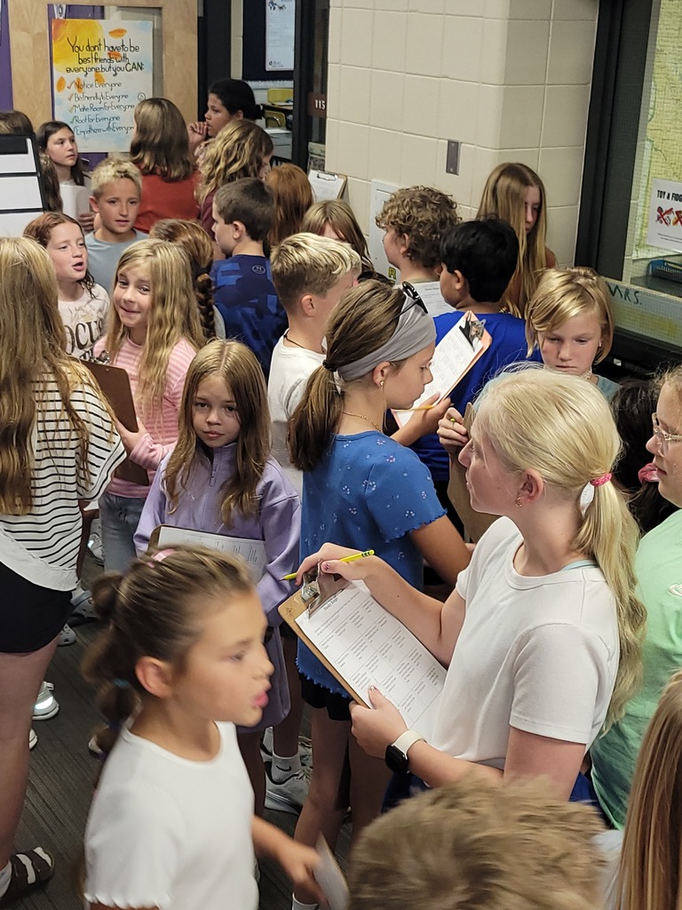 Hallway full of kids playing bingo.