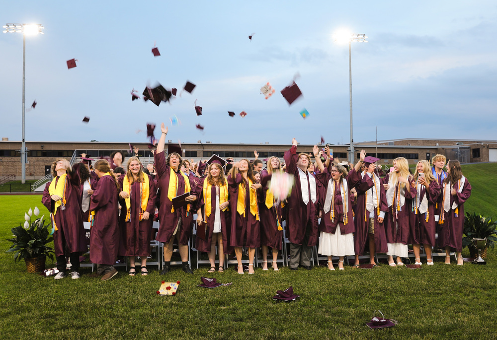 Class of 2026 throwing their caps into the air