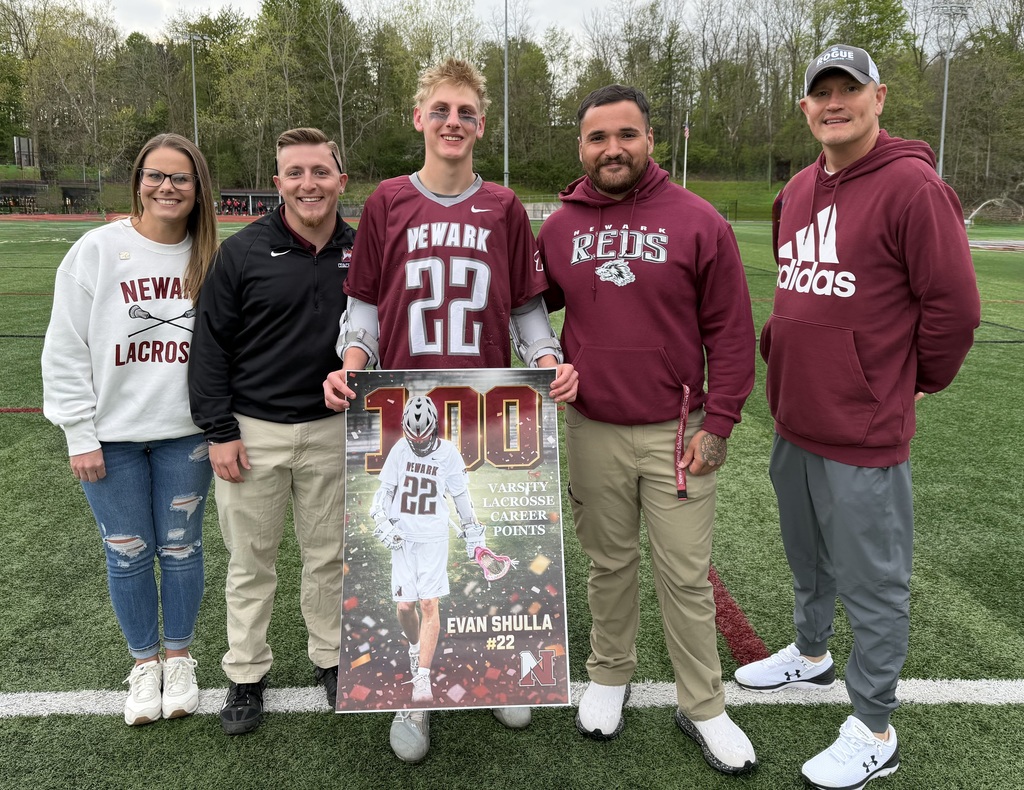 Pictured: Evan Shulla and family/coaches
