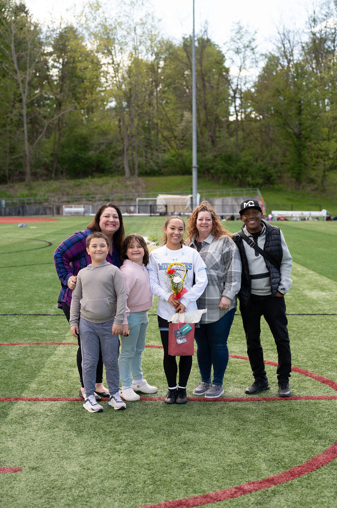 Pictured: Varsity girls lacrosse player and their family